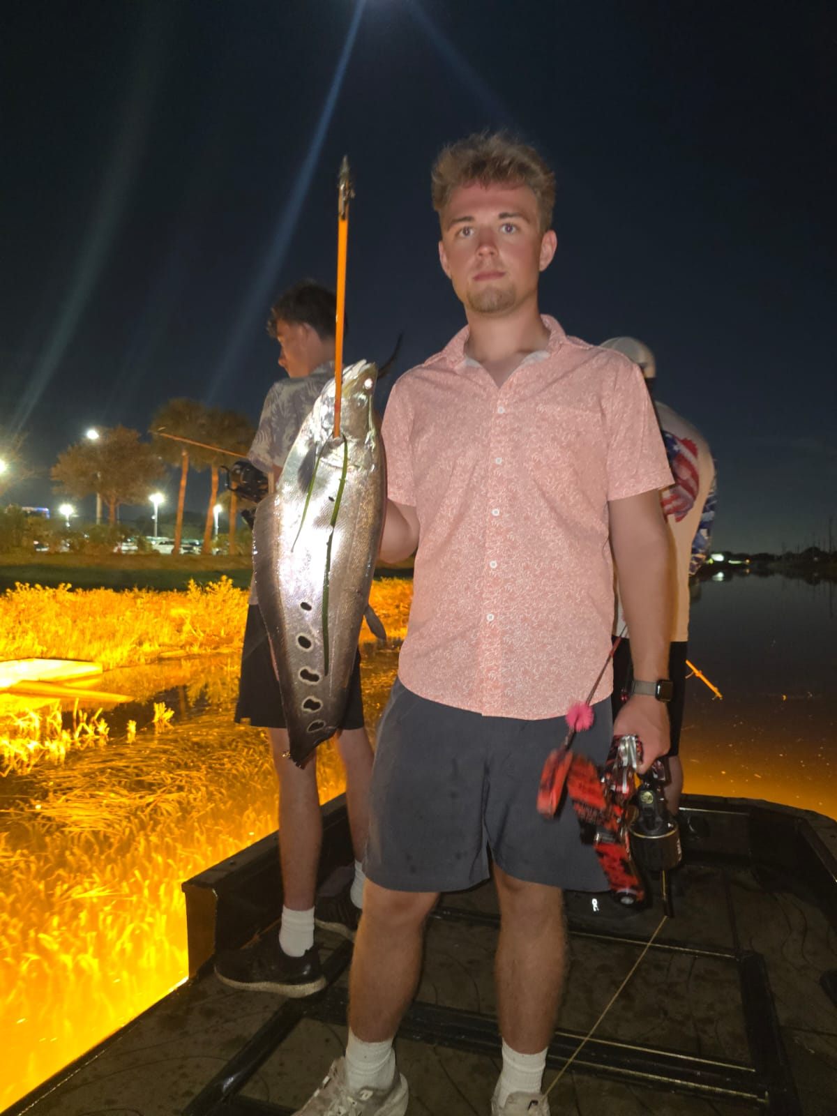 Native Roots Outdoor bowfishing trip photo with guests, fish, boat lights, and South Florida water