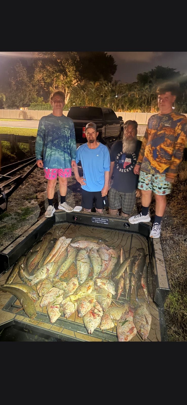 Native Roots Outdoor bowfishing trip photo with guests, fish, boat lights, and South Florida water