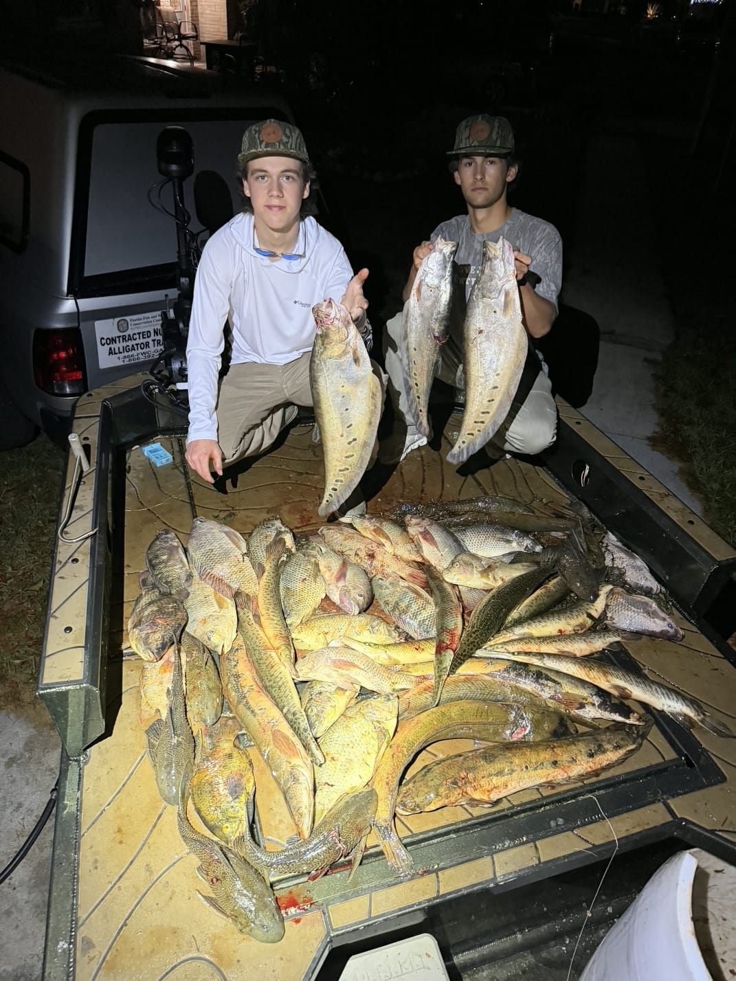 Native Roots Outdoor bowfishing trip photo with guests, fish, boat lights, and South Florida water
