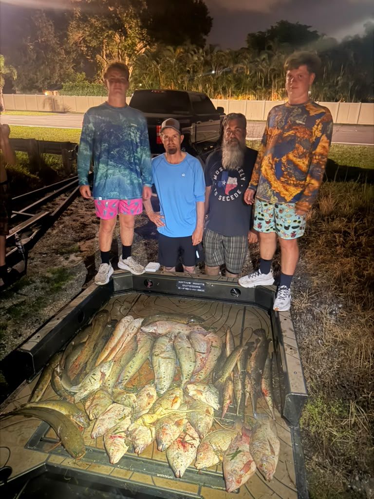 Native Roots Outdoor bowfishing trip photo with guests, fish, boat lights, and South Florida water