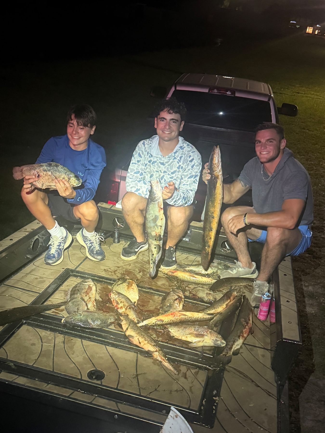 Native Roots Outdoor bowfishing trip photo with guests, fish, boat lights, and South Florida water
