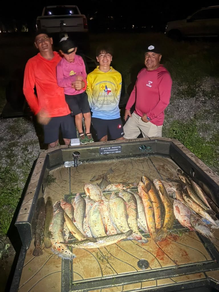 Native Roots Outdoor bowfishing trip photo with guests, fish, boat lights, and South Florida water