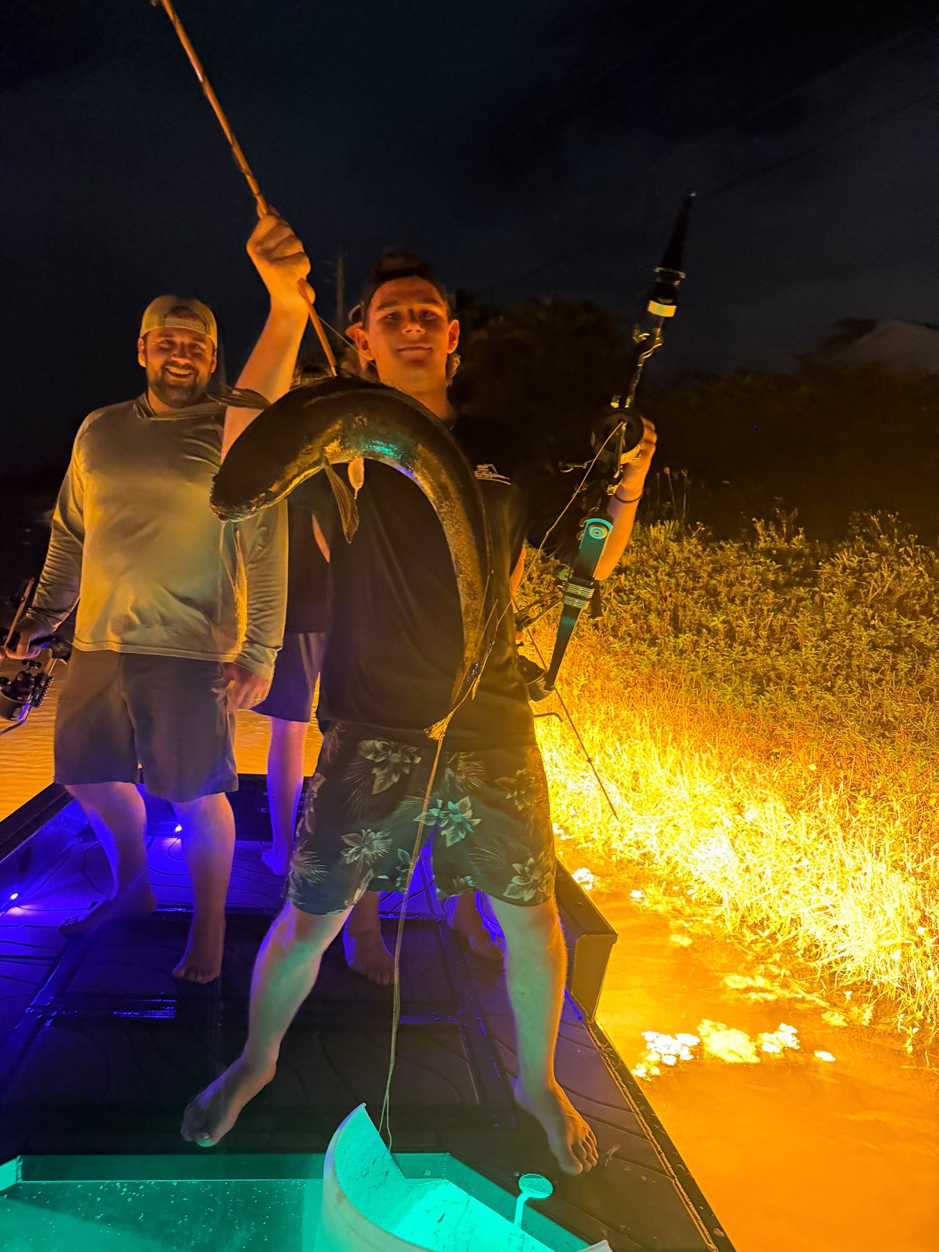 Native Roots Outdoor bowfishing trip photo with guests, fish, boat lights, and South Florida water