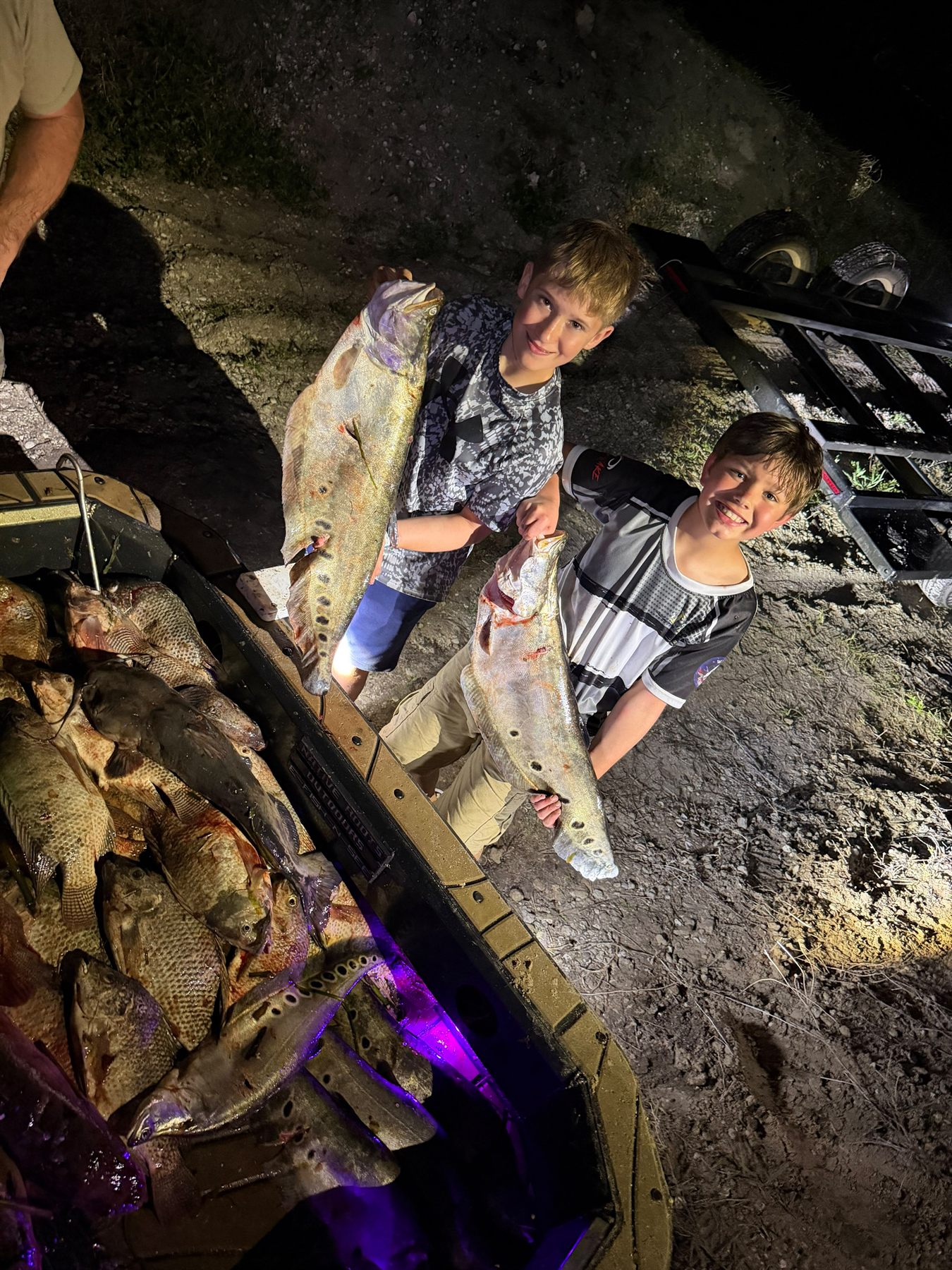 Native Roots Outdoor bowfishing trip photo with guests, fish, boat lights, and South Florida water