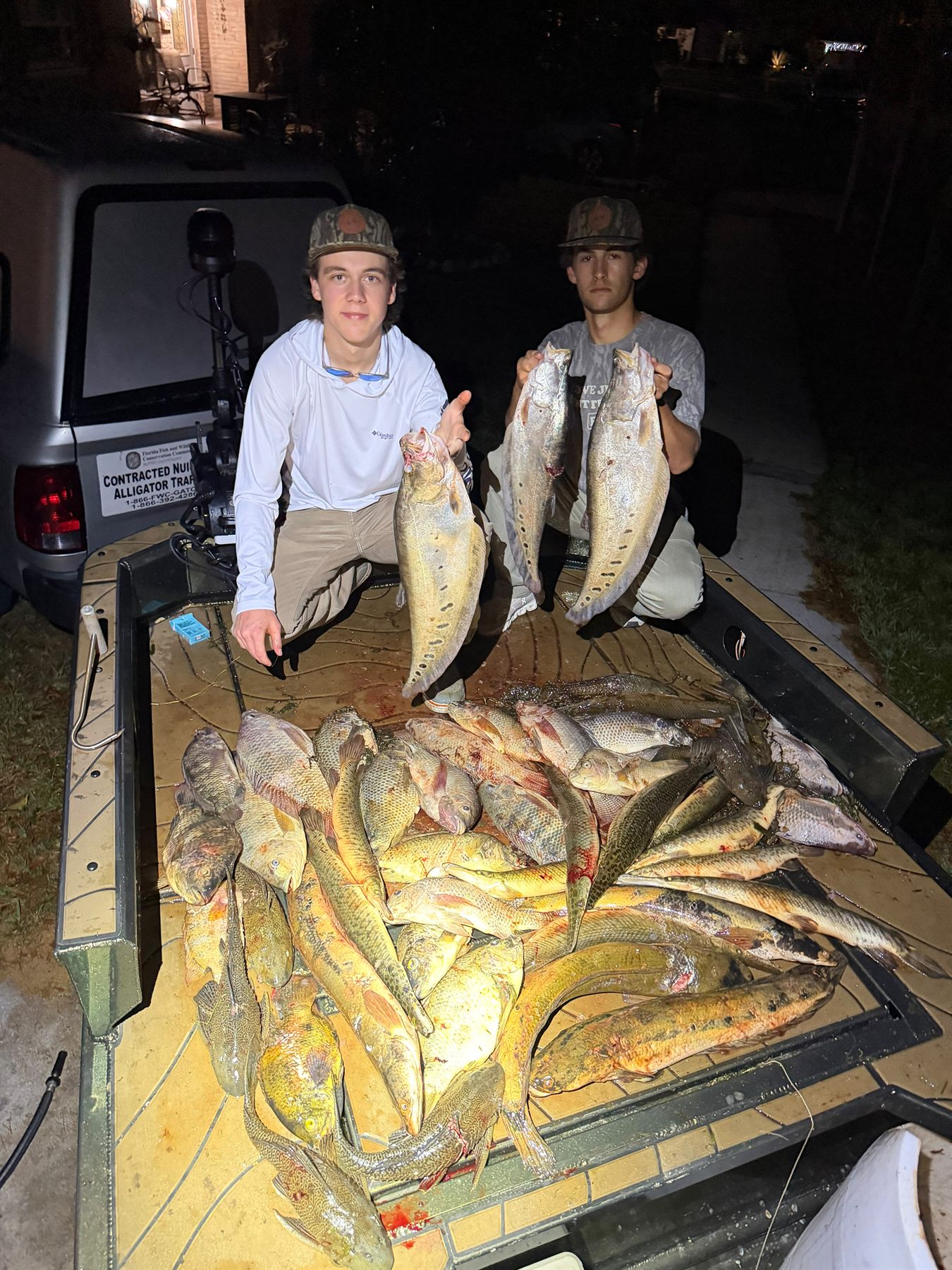 Native Roots Outdoor bowfishing trip photo with guests, fish, boat lights, and South Florida water