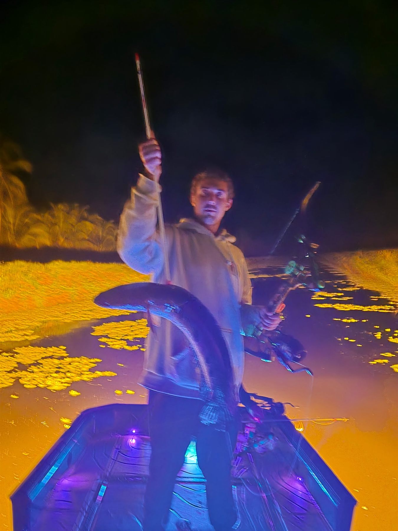 Native Roots Outdoor bowfishing trip photo with guests, fish, boat lights, and South Florida water