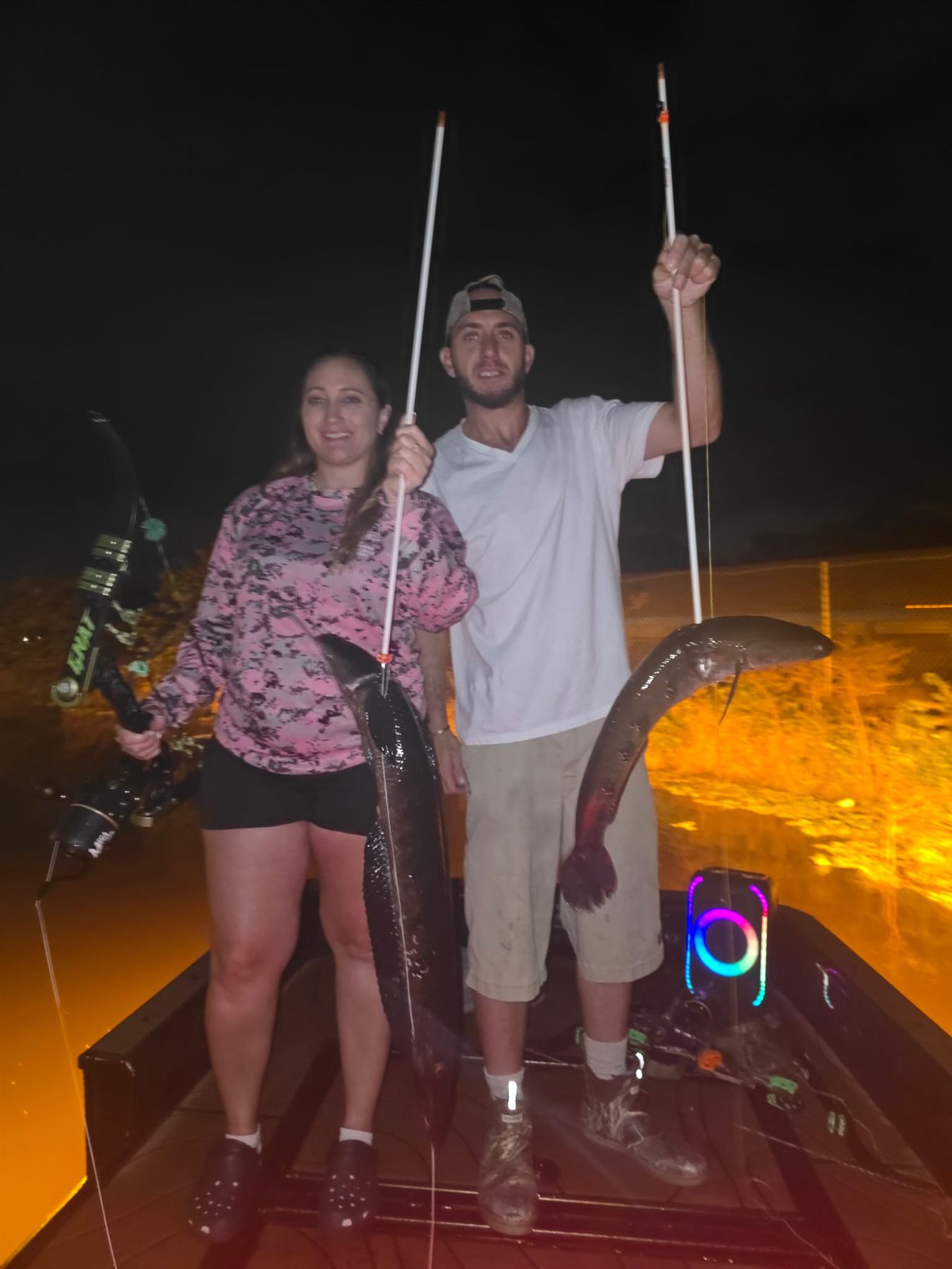 Native Roots Outdoor bowfishing trip photo with guests, fish, boat lights, and South Florida water